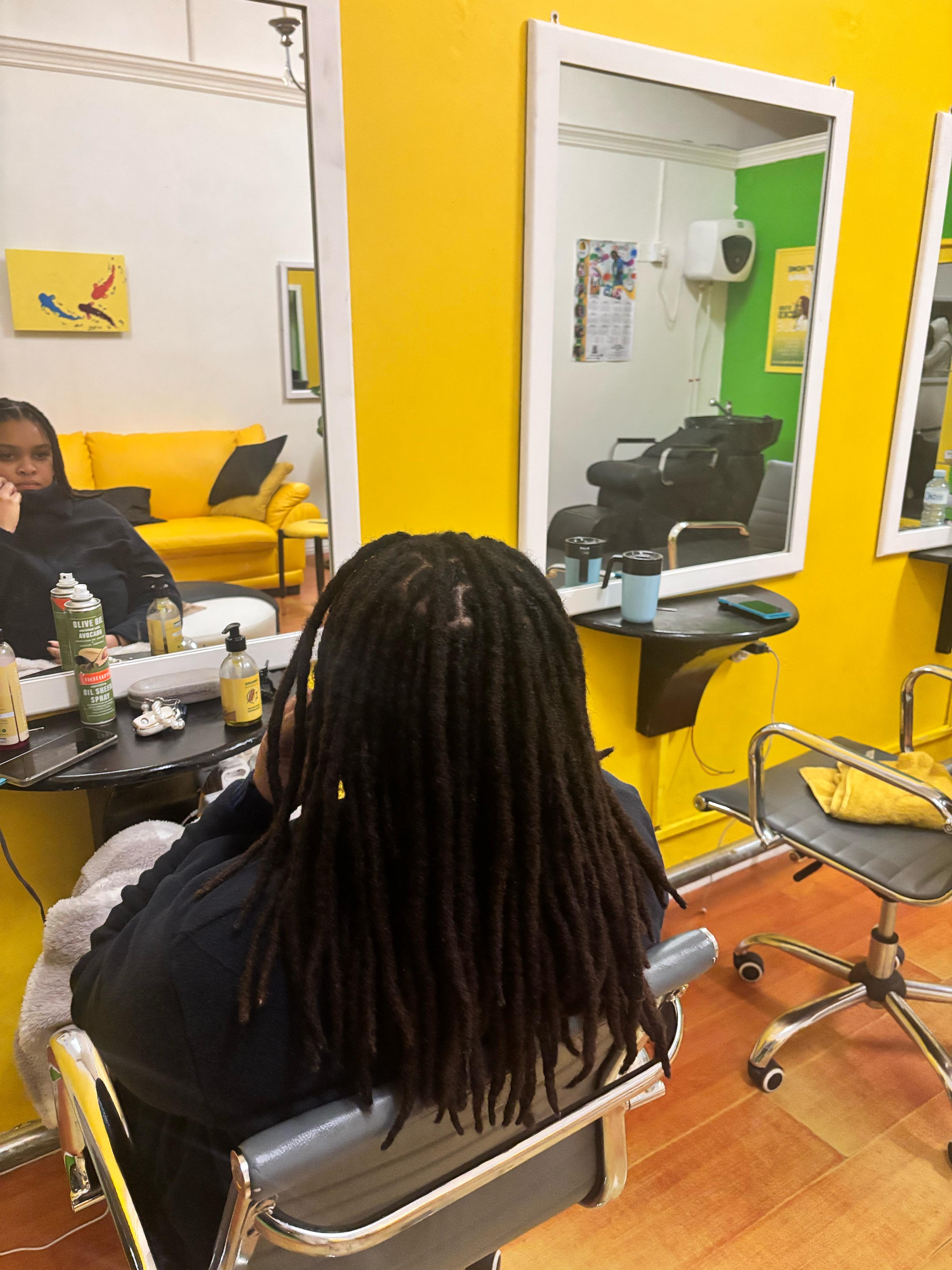 Smiling woman with dreadlocks
