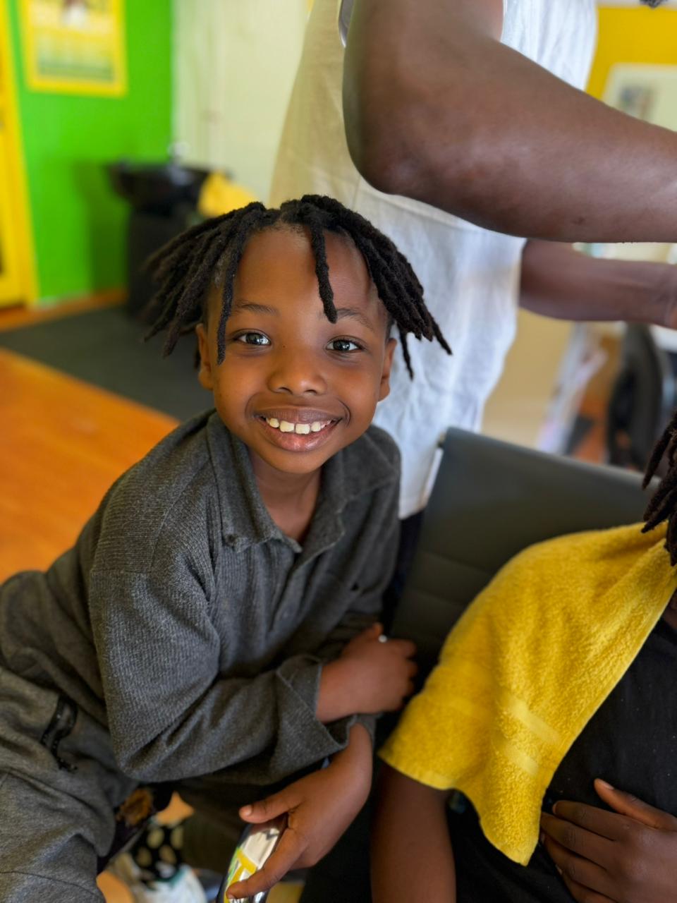 Client smiling with fresh locs